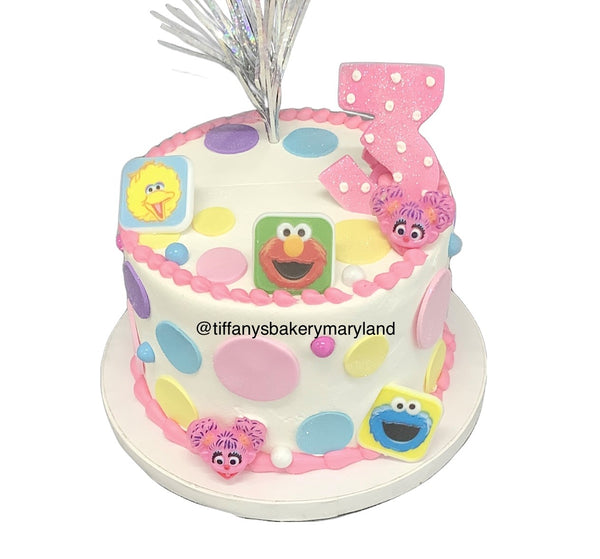 Sesame Street Character Rings on Round Cake.