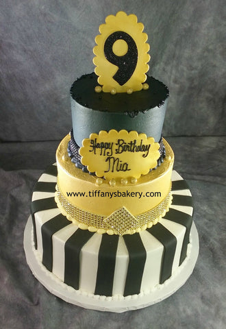 Three Tier Black and Gold Celebration Tier Cake