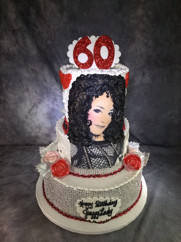 Portrait of a Lady on the Side of Three Tier Celebration Cake